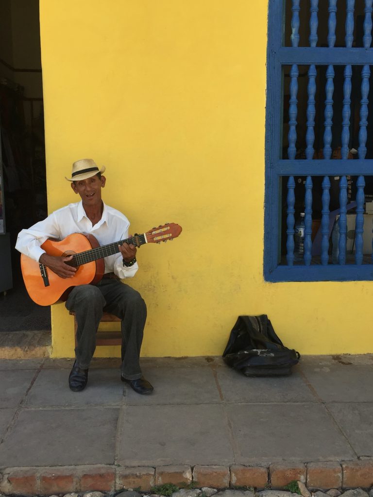 Man with guitar in Trinidad; Mercedes Santana