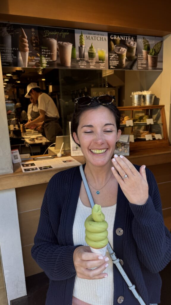 Mercedes eating a matcha soft serve from Chavaty Tea and Milk in Omotesando, Tokyo that turned her teeth green